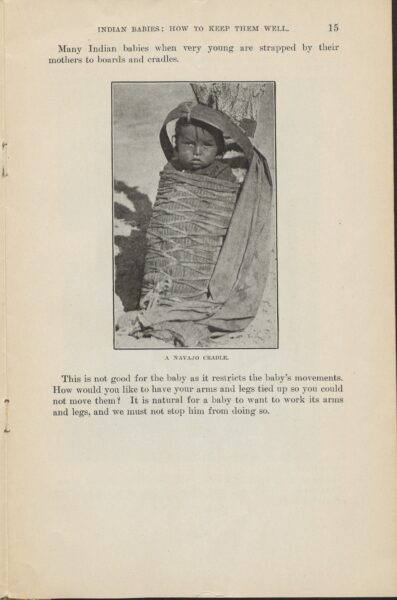 A page from a book. A photograph inserted into the text shows a baby swaddled and placed in an upright cradle, leaning against a tree. The photograph is captioned "A Navajo Cradle."